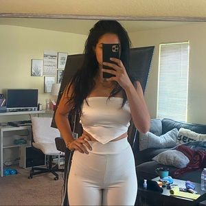 White small tube top shirt with open back.